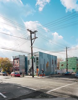 Green Urban Housing in Philadelphia - Photo 6 of 11 - The HardiePanel siding on the adjacent 100K and 120K houses is a dramatic break from East Kensington’s mostly brick facades. The simple, well insulated box and the absence of a third floor keep each house affordable, sustainable, and within the reach of young families.