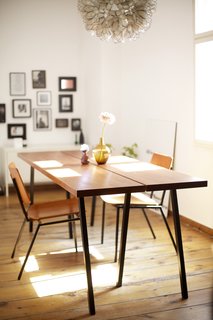 15 Flower Arrangements That Will Brighten Your Home on Valentine's Day - Photo 9 of 12 - Design Publishing Editor in Berlin, Germany<br><br>"Quite a few of our things come from places like Bolia, BoConcept and Hay, combined with flea market finds and DIY pieces. I built that table together with my dad. I had been looking for a table that would function both as a desk and a dining table for quite some time, but what I found wasn't either quite right or just too expensive. So I asked my dad, who's very handy, if he'd come to Berlin for a weekend and help me build my own table. It's exactly how I wanted it. The chairs came from a vintage store around the corner. I don't know if it's true, but the owner told me they were once used in a church in Denmark, and I varnished them to match the table top."