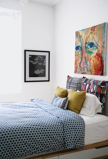 Budget-Friendly Renovation of a Neoclassical Home in Oslo - Photo 7 of 11 - Additional storage was added under the master bed to replace the closets lost in the renovation.