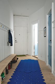 Budget-Friendly Renovation of a Neoclassical Home in Oslo - Photo 9 of 11 - Inspired by brightly colored doors in Notting Hill, London, Casper and Lexie chose a few distinct hues for interior doors in their renovated apartment, such as blue Flügger paint for the laundry room door.