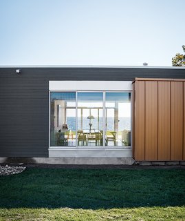 Modern Lakeside Retreat Stripped Down to the Basics - Photo 1 of 11 - In the house that Richard Williams designed for David Frum and Danielle Crittenden Frum on Lake Ontario, floor-to-ceiling windows from Oldcastle offer views through the house to the lake beyond.