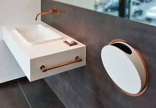 Arne Jacobsen designed these fixtures for Vola in 1968. In 2014, the Danish company added a deep copper finish to the line. Shown here is the 112 faucet and mixer series and the round series in-wall accessories.