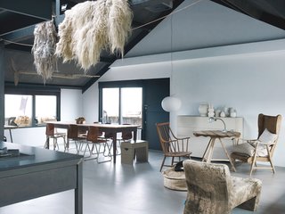 Leen and Middendorp’s living space is peppered with an assortment of objects and textures, including sheep’s wool, an antique French farmhouse table, salvaged chairs, a Glo-Ball light by Jasper Morrison for Flos, and an Axel leather sofa by Gijs Papavoine for Montis.
