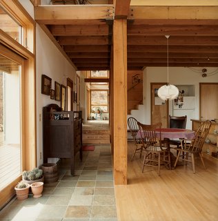 Structural timbers were salvaged from a local industrial building and demarcate the change in flooring surfaces.