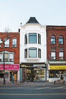 These Shop Owners Have a Killer Apartment Right Upstairs - Photo 5 of 10 - Many of the items in the home come from Mjölk, on the ground floor of Daoust and Baker’s building, which dates to the 1870s and has a distinctive tin facade.
