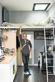 Modern, Lofted Beds For Tiny Spaces - Photo 1 of 8 - A skylight over the lofted bed and some clever storage moves, including magnetized spice containers overhead help maximize space in Austin's Matchbox house.