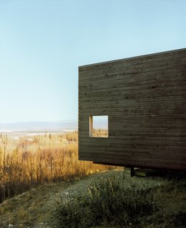 The charred cedar exterior gently basks in the Alaskan sun.
