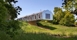 These 10 Refreshed Barns Bring Modern Living to the Countryside - Photo 7 of 10 - On the edge of a nature reserve a few miles from the Suffolk coast, the MVRDV-designed Balancing Barn cantilevers over the surrounding meadow.