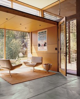 For the interior of the Stanwood residence, Logan returned to his minimalist palette of color and materials. The Stanwoods took particular zeal in furnishing the living area with a number of pieces from Limn in San Francisco, including a pair of B&B Italia chairs and a custom rug from Ligne Roset.