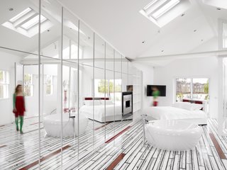 "We edited down until the house just became a pure white box," Rogers says. "By the end of it all, we rethought everything except the internal walls." The bright, skylit master bedroom is accented with Richard Woods’s iconic grains, which grace the floor.