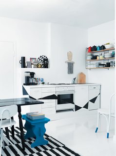 20 Dream Kitchens - Photo 7 of 20 - Fine Finnish<br><br>In the kitchen of this tightly-packed apartment in Helsinki, Finland, Susanna and Jussi tore down the ceiling and wall cabinets with the help of Jussi’s father, a skilled craftsman. "Behind the cabinets we found lovely little nooks that work perfectly as shelves for things like salt and pepper mills. When you strip everything to its original state, you are able to see what the house is truly about."<br><br>Photo by: Petra Bindel