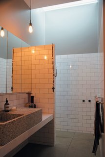 Gorman and Angelucci make use of the en suite master bathroom that sits just behind their inexpensive walk-in closet with messmate facing.