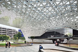 They consolidating surface parking in a new garage and uniting the campus with a canopy whose composite-aluminum skin is dappled with triangular perforations.