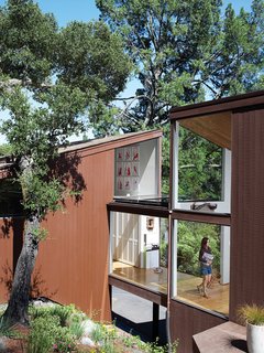 Alexander walks from the bedroom pod into the living room under her freeway-inspired sculpture, titled Run A Way.