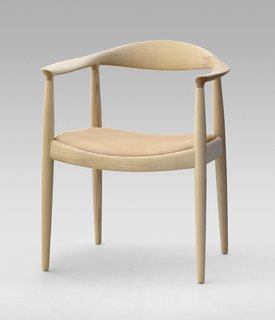 The Round Chair from 1949 is one of Wegner's most iconic pieces and a highlight of Danish design. "Round One" is minimalist art reduced to its bare essentials. It required incredible craftsmanship to create such smooth curves—each of the crescent-shaped armrests are fashioned from a block of wood, and interior mortise-and-tenons hide the connection between the arms and legs. Famously, when Kennedy and Nixon sweated it out during the first televised Presidential debate, they were both sitting on Wegner’s design. Manufactured by PP Møbler. Photo by Jens Mourits Sørensen.