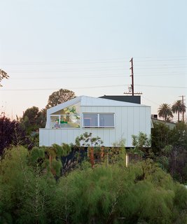 From the deck off the master bedroom, Eric Grunbaum looks across his front yard. Barbara Bestor designed the second story to float over the ground "like a cloud."