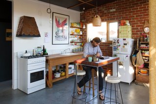 Fuscaldo and Krien found an old workbench and used the wood to create the counter around the kitchen sink. Photo by Nic Granleese.