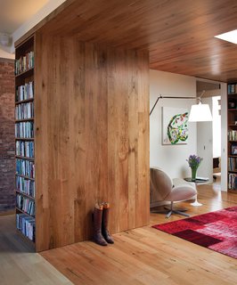 "It was a natural choice," says Adrian of using reclaimed and rescued wood. "I didn’t want to chop down a whole lot of trees." The walls and ceiling are lined with planks of butternut harvested from diseased trees in Vermont.