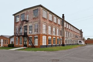 A 19th-century New York factory houses both Brandon and Amy Phillips’s apartment and the workshop for their company, Miles & May Furniture Works.