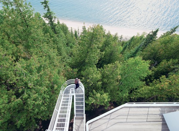 Located on the shore of Lake Michigan, the 1973 Douglas House was one of architect Richard Meier’s first residential commissions. Defined by its verticality, the house features an exterior stepped walkway that extends over the trees, connecting the levels.