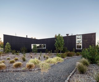15 Modern Homes with Black Exteriors - Photo 10 of 15 - A Chilean home’s dramatic stained-pine exterior references local vernacular architecture.