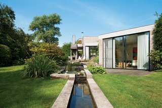A Concrete Home in Rural Belgium - Photo 2 of 9 - When Belgian fashion retailer Nathalie Vandemoortele was seeking a new nest for her brood, she stumbled upon a fortresslike house in the countryside designed in 1972 by a pair of Ghent architects, Johan Raman and Fritz Schaffrath. While the Brutalist concrete architecture and petite but lush gardens suited her tastes to a tee, the interiors needed a few updates.