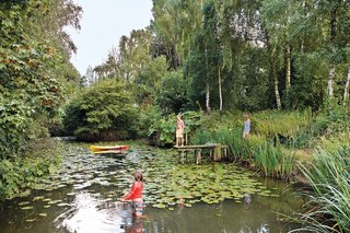 A Concrete Home in Rural Belgium - Photo 6 of 9 - Vandemoortele’s young sons and their friends enjoy the house’s nearly one-acre site as well, especially the lily pad–stocked pond.