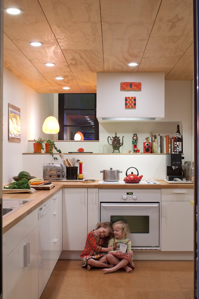Pippa (left) and Maisie (right) play in the kitchen. Though Hale and Edmonds would have preferred Bosch appliances, a deal at Ikea was too good to pass up. They purchased all of the cabinets and appliances (a combination that earned them 20-percent off the total) for a mere $4,700.