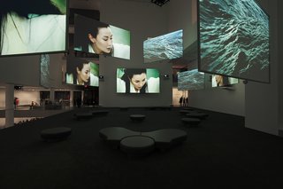 Heatherwick Studio at Design Indaba - Photo 5 of 9 - Ten Thousand Waves, the nine-screen installation by Isaac Julien, pictured here while on display at the Museum of Modern Art, will be part of MOCAA’s permanent collection and be featured in MOCAA’s atrium. Other highlights include pieces from Africans from all over the continent and the diaspora, including work by Kudzanai Chiurai, Nandipha Mntambo, Edson Chagas, and Zanele Muholi. Mark Coetzee, the collection’s curator, is originally from South Africa and says building a contemporary art museum in Africa is a dream come true. "I’ve always wanted to do this since I was a kid," Coetzee says. "Normally collectors collect what they collect, and at a certain point, they say ‘Let’s start a museum,’" he says. By contrast, Jochen Zeitz gave Coetzee the go-ahead to build a collection with the scale and ambition for a museum from the outset.<br><br>Photo courtesy: Isaac Julien