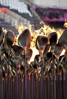 Heatherwick Studio at Design Indaba - Photo 9 of 9 - Olympic CauldronA billion people tuning into the Olympics’ opening ceremony meant all eyes on the torch—or at least on the person carrying it. Heatherwick says nobody remembers the Olympic Cauldron. "People remember people, not objects." So the London Olympics featured seven young athletes carrying copper cones of fire—"Gold, silver, and bronze were busy for those two weeks"—and touched the cauldron with their torches until the flames spread around in circles. Some 204 stems, each representing a country, rose together to form a single massive flame—truly more than the sum of its parts.<br><br>Photo by: Edmund Sumner