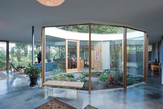 The Heids incorporated mostly native plants into the courtyard, which Andrew designed as an ovoid decagon. The George Nelson Platform bench is from Design Within Reach. Solarban low-e glass improves insulation. The layout, says Andrew, is meant to "bring people together."