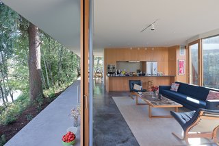 Among the few new pieces the couple acquired for the house is a blue Bantam sofa from Design Within Reach, which complements the Westnofa Siesta chairs by Ingmar Relling in the living room. The kitchen includes a Jenn-Air refrigerator and a Bosch oven.