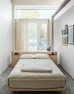 This Light-Filled Industrial Renovation Plays Host to Live Music - Photo 5 of 11 - The guest bedroom features a custom bed and headboard by Henstein’s Custom Cabinets of Clackamas, Oregon, outfitted with bedding from the Terra Nova collection by Jack Lenor Larsen for Martex.