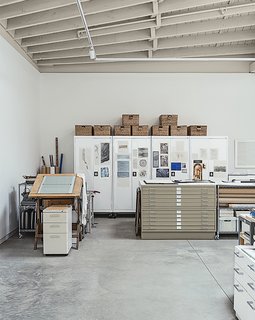 This Light-Filled Industrial Renovation Plays Host to Live Music - Photo 6 of 11 - Rolling cabinets by Sandusky proved a handy storage solution in Hutchins’s studio.