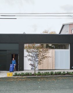 This Light-Filled Industrial Renovation Plays Host to Live Music - Photo 9 of 11 - Perforated metal screens, one of which doubles as the front door, shield the storefront window from the street.
