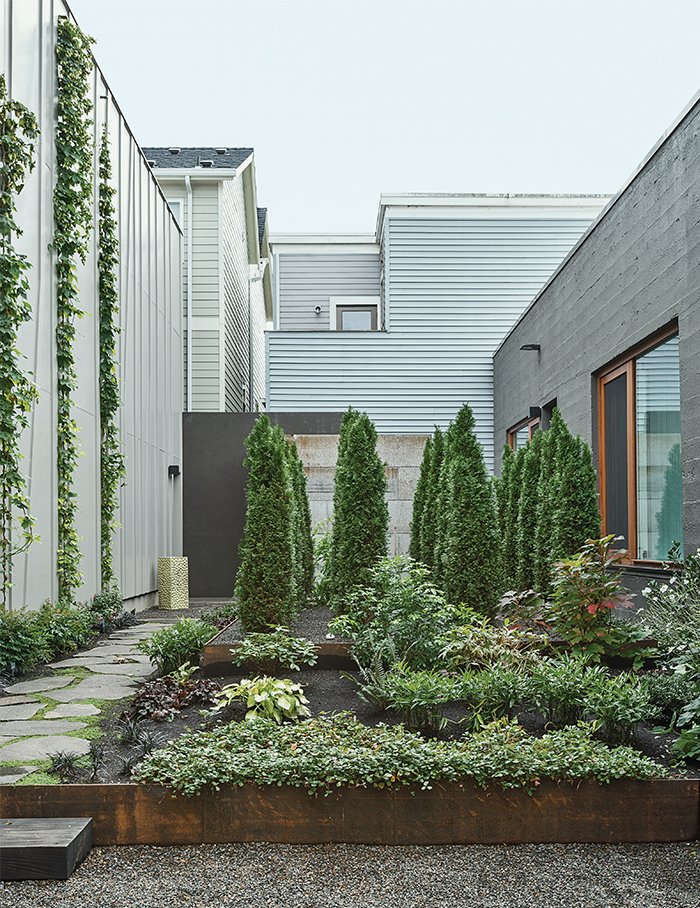 Hutchins and Montague worked with Samuel H. Williamson Associates Landscape Architecture on the garden, which is planted with sword ferns, vine maple, and wild ginger. “When we look at it from the bedroom, it’s our private little forest,” Montague says.