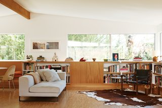The living room has a Dadone sofa by Antonio Citterio for B&B Italia and a Safari chair by Arne Norell.