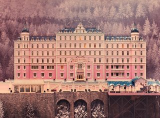 Exterior of the Grand Budapest Hotel, created with miniatures. One place in particular loomed large as an influence, the Grand Hotel Pupp, the gem of Karlovy Vary, a famed spa town in the Czech Republic that hosts an annual film festival. It’s part of a strip of pastel-painted buildings on the Slovenska River in the city center, all painted in shades of tangerine, pistachio and bright yellow ochre that inspired Stockhausen. He says the exterior of the Pupp is the closest thing to the Grand Budapest.