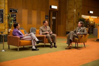 Jason Schwartzman (left) as "M. Jean," Jude Law (center) as "Young Author" and Director Wes Anderson (right). The film’s depiction of the hotel’s ‘60s low point showcased a blockish, brutish, Soviet-era style -- an interior that was "Eastern Bloc-ified," according to Stockhausen. The film was co-produced with Studio Babelsberg, in nearby Potsdam, and Stockhausen utilized their prop warehouse to source authentic period colors and designs.