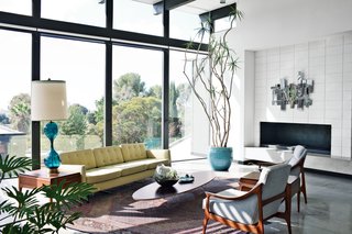 The First LEED Gold-Certified Family Home in San Diego - Photo 7 of 13 - A Nelson sofa sits on a handmade Persian Mahi rug in the living room.