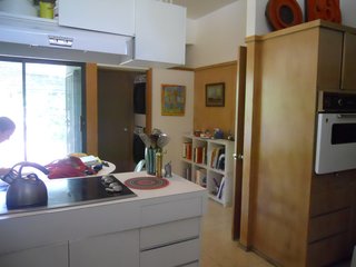 BEFORE: Without the additional lumination from the added kitchen window, the Houser home's kitchen rior to renovation is dark and incompatible with the surrounding spaces.