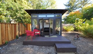 10 Ways to Use Rugs in Your Outdoor Space This Spring - Photo 9 of 10 - A raised deck with bold chairs and simple welcome mat finish this work retreat. 