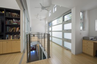 Upstairs, passive ventilation gets an assist from high-efficiency Emerson ceiling fans. Photo by Ken Pagliaro Photography.