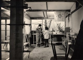 George Nakashima with his daughter Mira in his workshop