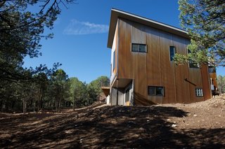Mountaintop Modern - Photo 2 of 8 - The corrugated steel that was chosen for the exterior was designed to weather over time. A rust-hued patina is already taking hold. Photo by Barry B. Doyle.