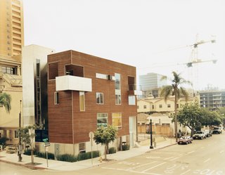 Both houses, viewed from across State Street. All walls were built in the empty lot next door as the foundation was poured, cutting down on costly construction time. The hazy skies in this photograph can be attributed to the Southern California fires of 2003.