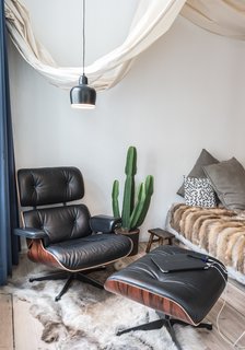 Salon of the Freunde von Freunden X Vitra ApartmentTented fabric provides separation for the bedroom, and plays off the room's array of textures.Photo by Steve Herud
