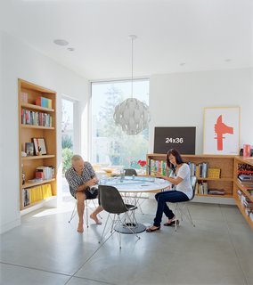 The dining room is meant to be a flexible space for eating or dancing. "One of the most important things for me," explains Grunbaum, "is how a house feels. It has to be a place where you don’t want to leave." The Cyclone table is by Isamu Noguchi for Knoll and the pendant lamp is by Lightoiler.