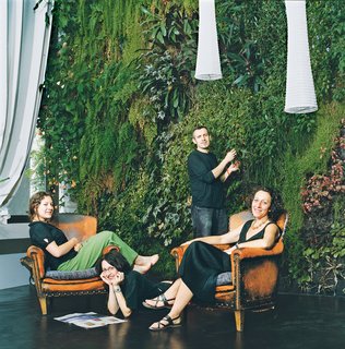 The Dimanches relax in their exotic living room.