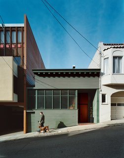Farnham walks the couple’s Vizsla, Kasia, down the sloped alley upon which the <br><br>house sits. Hill’s renovation maintains some Victorian character in the decorative eaves <br><br>and scaling, but the home is largely an anomaly for San Francisco.